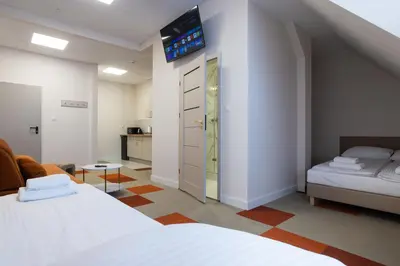 Łóżko lub łóżka w pokoju w obiekcie Moon Apartments Wrocław