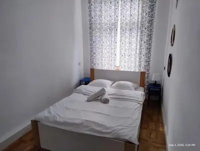Łóżko lub łóżka w pokoju w obiekcie Piastowska Apartment