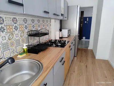 Kuchnia lub aneks kuchenny w obiekcie Piastowska Apartment