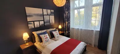 Łóżko lub łóżka w pokoju w obiekcie Niebieski apartament pod Borową Górą