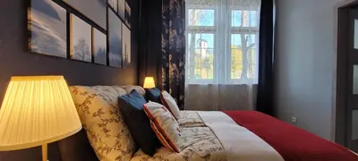 Łóżko lub łóżka w pokoju w obiekcie Niebieski apartament pod Borową Górą