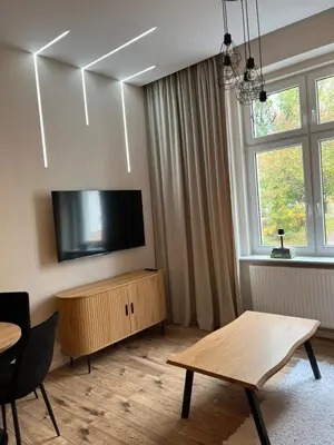 Telewizja i/lub zestaw kina domowego w obiekcie Apartament z antresolą Stare Miasto