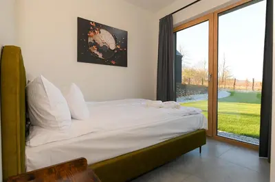 Łóżko lub łóżka w pokoju w obiekcie Górskie Kąty Resort Michałkowa