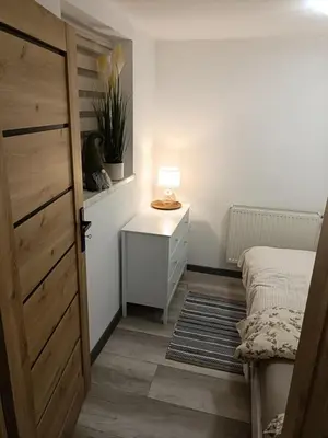 Łóżko lub łóżka w pokoju w obiekcie Apartament w Słupcu z PS5 WIFI HBO