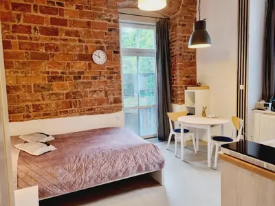 Łóżko lub łóżka w pokoju w obiekcie Stara Poczta Apartament