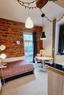 Łóżko lub łóżka w pokoju w obiekcie Stara Poczta Apartament