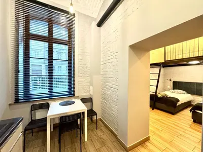 Łóżko lub łóżka w pokoju w obiekcie Apartament Paryski 1- loftowe studio blisko Rynku