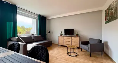Telewizja i/lub zestaw kina domowego w obiekcie GRAFIT - Apartament na wzgórzu - Polanica Zdrój