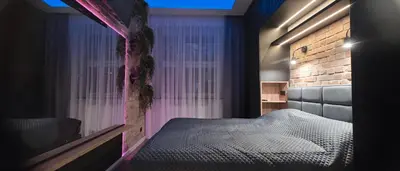 Łóżko lub łóżka w pokoju w obiekcie Apartament centrum - loft Plac Piłsudskiego