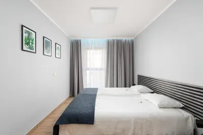 Łóżko lub łóżka w pokoju w obiekcie Hubska Apartments