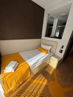 Łóżko lub łóżka w pokoju w obiekcie Eclipse Budget Rooms