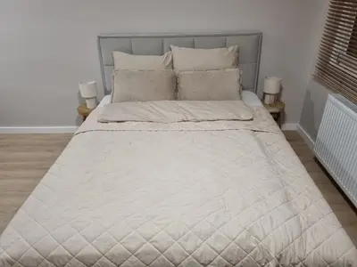 Łóżko lub łóżka w pokoju w obiekcie Apartament Sobótka