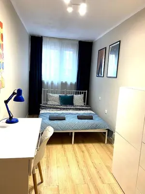 Łóżko lub łóżka w pokoju w obiekcie UniVibes