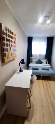 Łóżko lub łóżka w pokoju w obiekcie UniVibes
