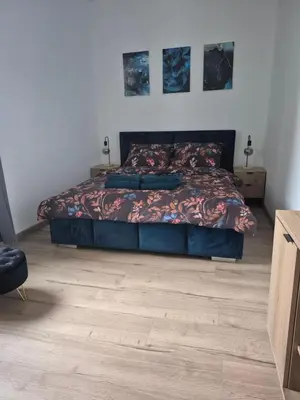 Łóżko lub łóżka w pokoju w obiekcie Apartament Moniuszko