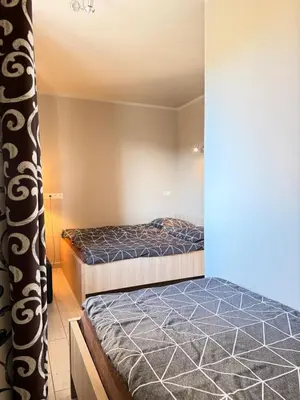 Łóżko lub łóżka w pokoju w obiekcie Apartamenty Gliwicka 12