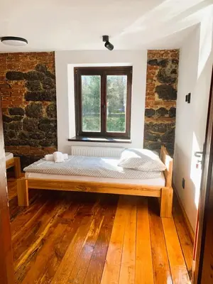 Łóżko lub łóżka w pokoju w obiekcie Zamek Bożejów - Skansen