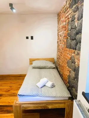 Łóżko lub łóżka w pokoju w obiekcie Zamek Bożejów - Skansen