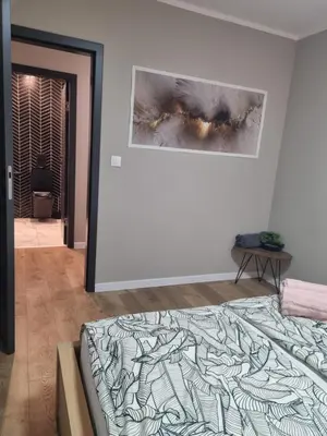 Łóżko lub łóżka w pokoju w obiekcie LAVAN Gliwice