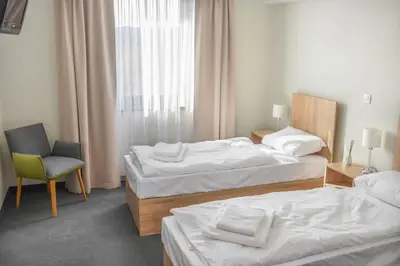 Łóżko lub łóżka w pokoju w obiekcie ARGENTIA noclegi