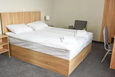 Łóżko lub łóżka w pokoju w obiekcie ARGENTIA noclegi