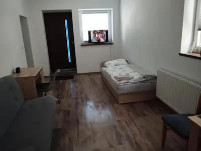 Łóżko lub łóżka w pokoju w obiekcie Apartament Wiosenny Biały Domek
