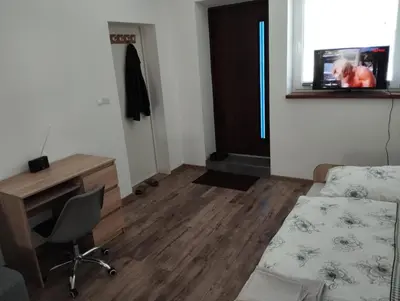 Telewizja i/lub zestaw kina domowego w obiekcie Apartament Wiosenny Biały Domek