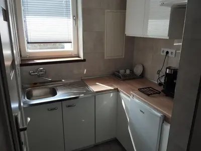 Kuchnia lub aneks kuchenny w obiekcie Apartament Wiosenny Biały Domek
