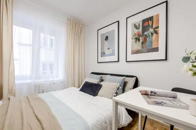 Łóżko lub łóżka w pokoju w obiekcie Old Town CityStay Rynek ul Więzienna 30 apartment 6