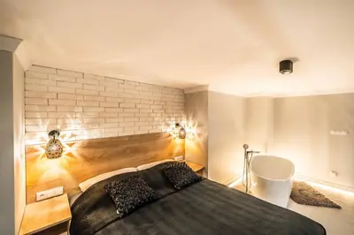 Łóżko lub łóżka w pokoju w obiekcie Adria City Loft