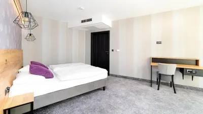 Łóżko lub łóżka w pokoju w obiekcie Czarna Perła Apartamenty - bezpłatny basen - Czarna Góra Resort - Sienna