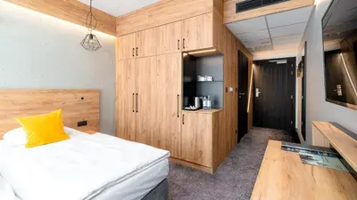 Łóżko lub łóżka w pokoju w obiekcie Czarna Perła Apartamenty - bezpłatny basen - Czarna Góra Resort - Sienna