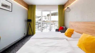 Łóżko lub łóżka w pokoju w obiekcie Czarna Perła Apartamenty - bezpłatny basen - Czarna Góra Resort - Sienna