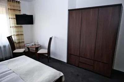 Łóżko lub łóżka w pokoju w obiekcie Restauracja Stylowa
