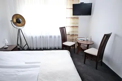Łóżko lub łóżka w pokoju w obiekcie Restauracja Stylowa