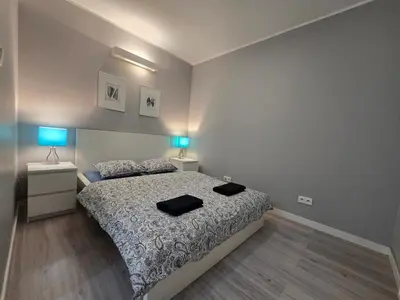 Łóżko lub łóżka w pokoju w obiekcie Happy Estate - ul Krawiecka 1 - BLISKO RYNEK