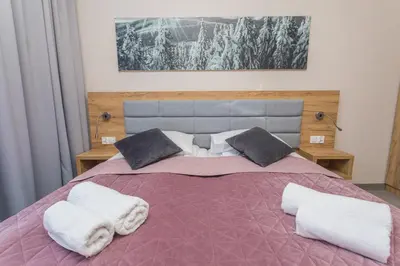 Łóżko lub łóżka w pokoju w obiekcie Aparthotel Apartamenty Czarna Góra 418