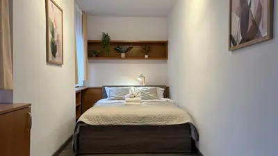 Łóżko lub łóżka w pokoju w obiekcie Rynek Wrocław 3-Bedroom Apartment by BookingHost
