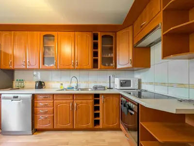 Kuchnia lub aneks kuchenny w obiekcie Krzywoustego City Comfort Apartment by BookingHost