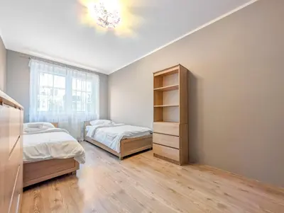 Łóżko lub łóżka w pokoju w obiekcie Krzywoustego City Comfort Apartment by BookingHost