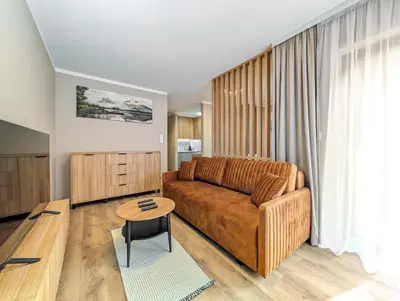 Część wypoczynkowa w obiekcie Reymonta Deluxe Apartment by BookingHost