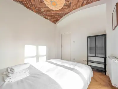 Łóżko lub łóżka w pokoju w obiekcie Szczytnicka 29 Superior Apartment by BookingHost