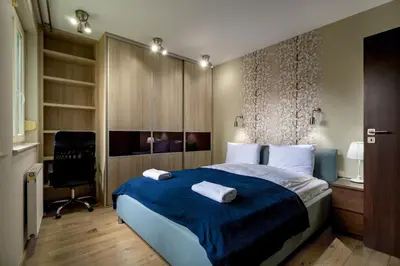 Łóżko lub łóżka w pokoju w obiekcie RentPlanet - Apartament Borowska