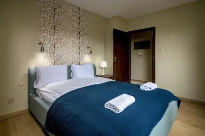 Łóżko lub łóżka w pokoju w obiekcie RentPlanet - Apartament Borowska