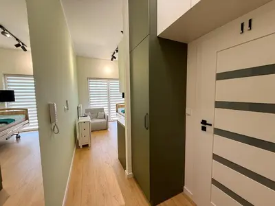 Łóżko lub łóżka w pokoju w obiekcie Apartament Szałwiowa