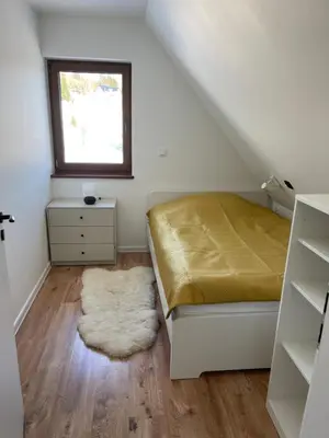 Łóżko lub łóżka w pokoju w obiekcie Domek Rodzinny Martynka