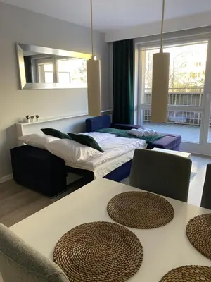 Łóżko lub łóżka w pokoju w obiekcie Apartament Da Vinci