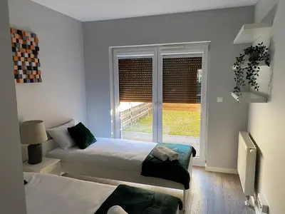Łóżko lub łóżka w pokoju w obiekcie Apartament Da Vinci