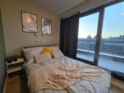 Łóżko lub łóżka w pokoju w obiekcie Apartament Centrum Krawiecka 1