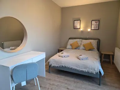 Łóżko lub łóżka w pokoju w obiekcie Apartament Centrum Krawiecka 1
